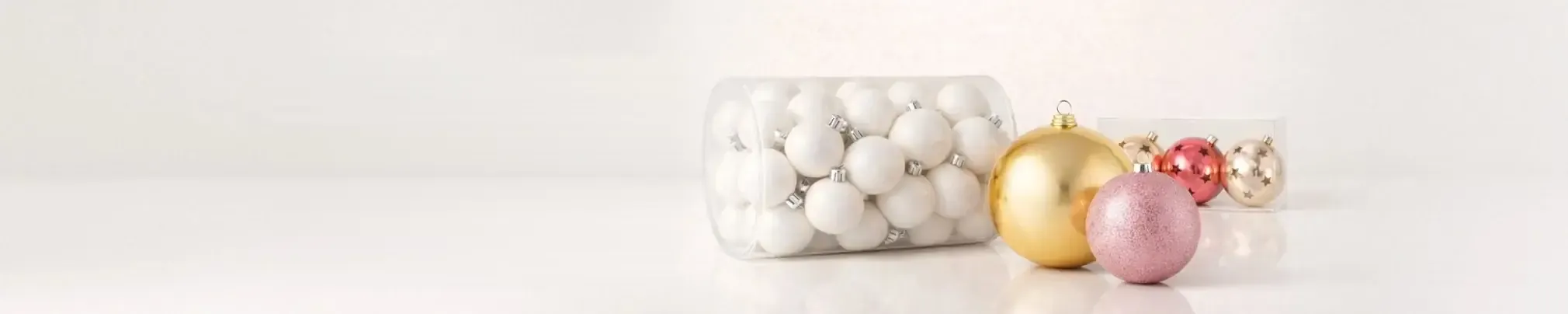 Sets of Christmas baubles in white, gold and pink